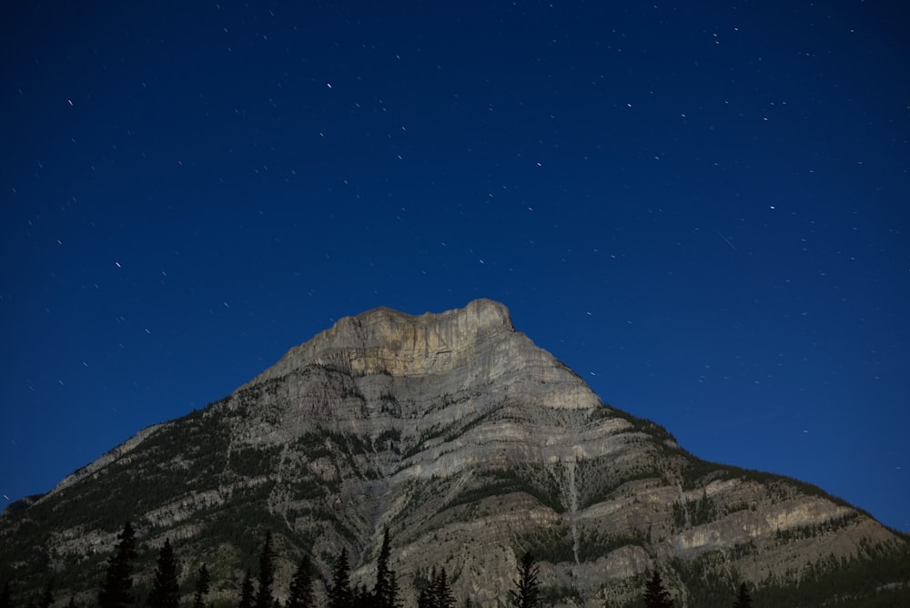 worm's-eye view photography of mountain under blue sky