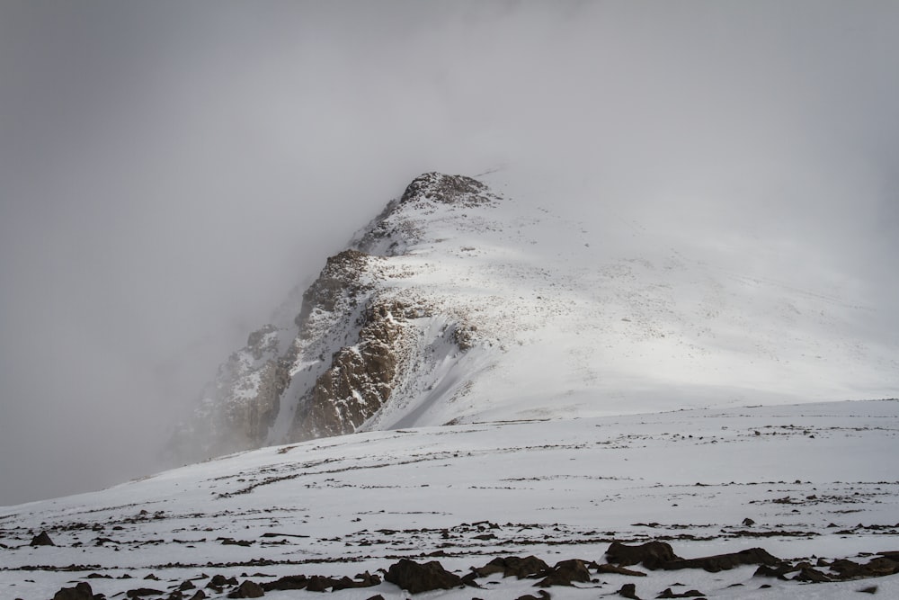 brown mountain covered white snow