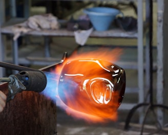 person holding torch and metal