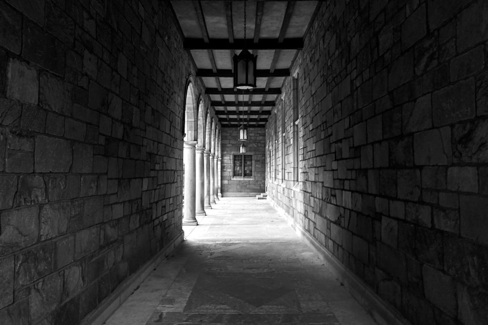 view photography of gray concrete brick tunnel