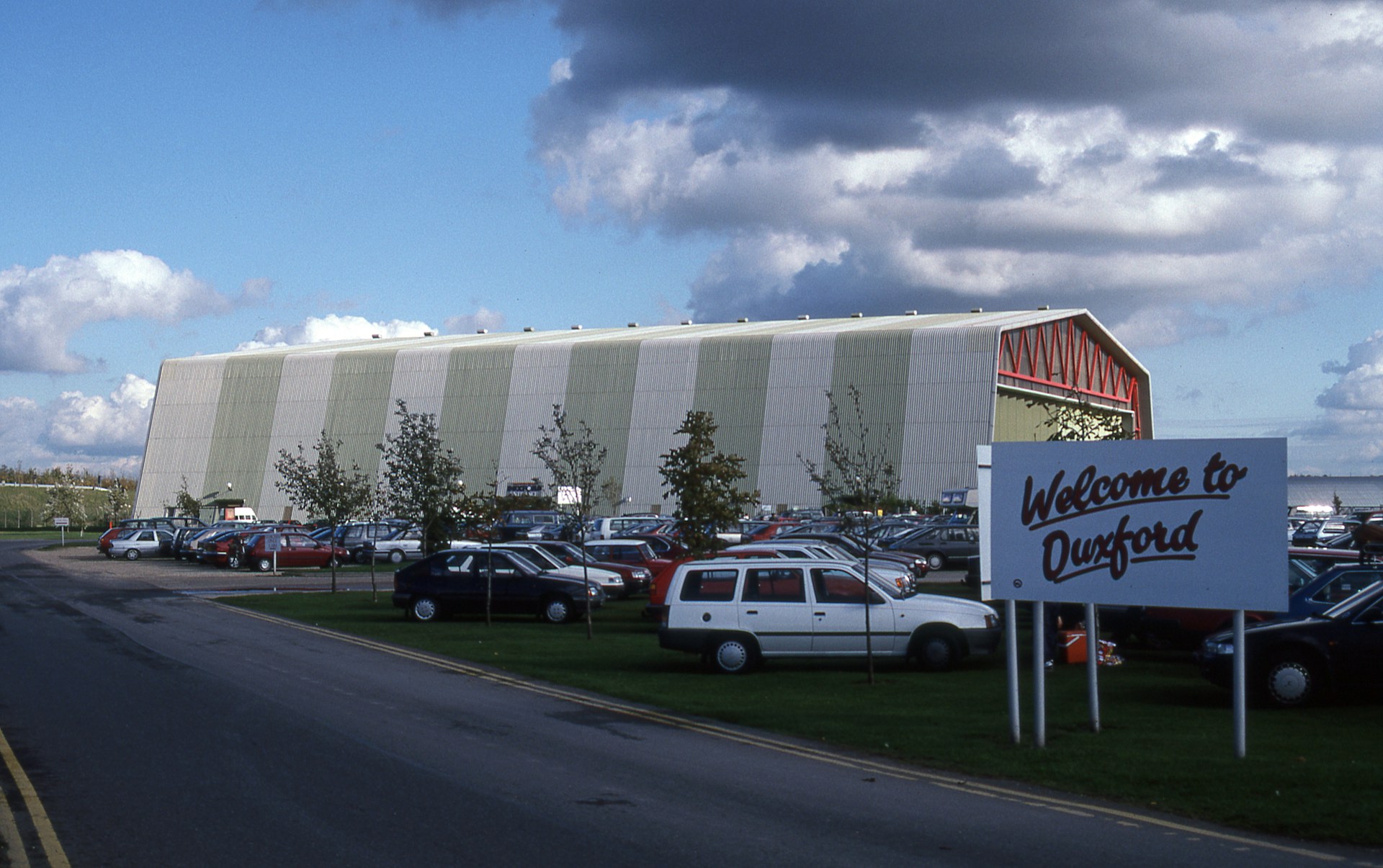 woman wearing yellow long-sleeved dress under white clouds and blue sky during daytime