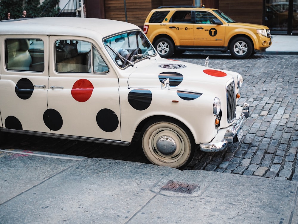 white polka-doted vehicle parked during daytime