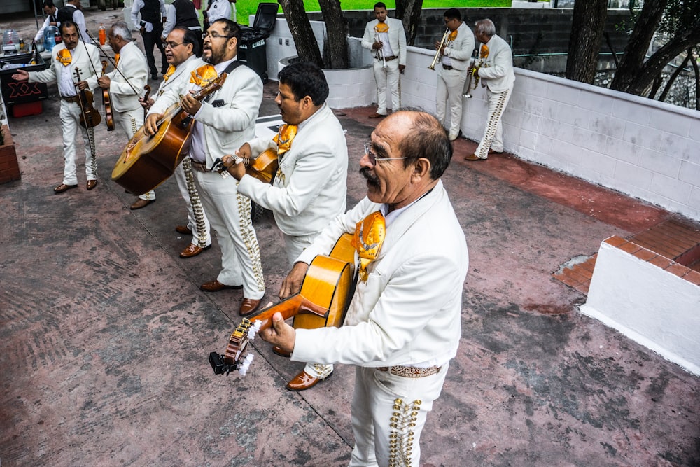 group of musicians playing instruments on stage