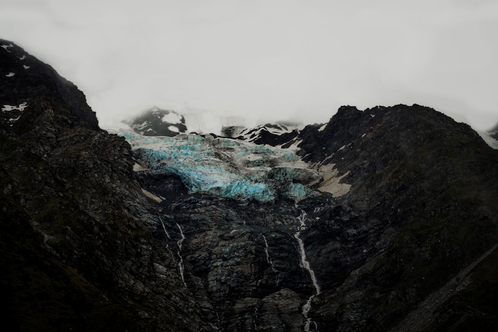 black mountain with snow during daytime