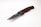 A folding knife with a sleek, metallic blade and a handle featuring a wood-like texture. The knife is partially open, displaying the brand name 'TACKLIFE' on the blade. The handle appears ergonomic and is designed for a firm grip.