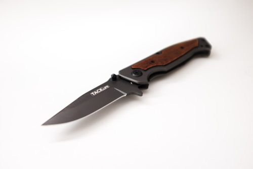 A folding knife with a sleek, metallic blade and a handle featuring a wood-like texture. The knife is partially open, displaying the brand name 'TACKLIFE' on the blade. The handle appears ergonomic and is designed for a firm grip.