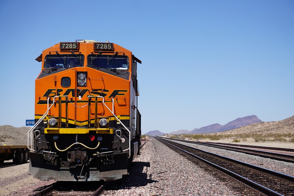 orange BNSF train at the rail