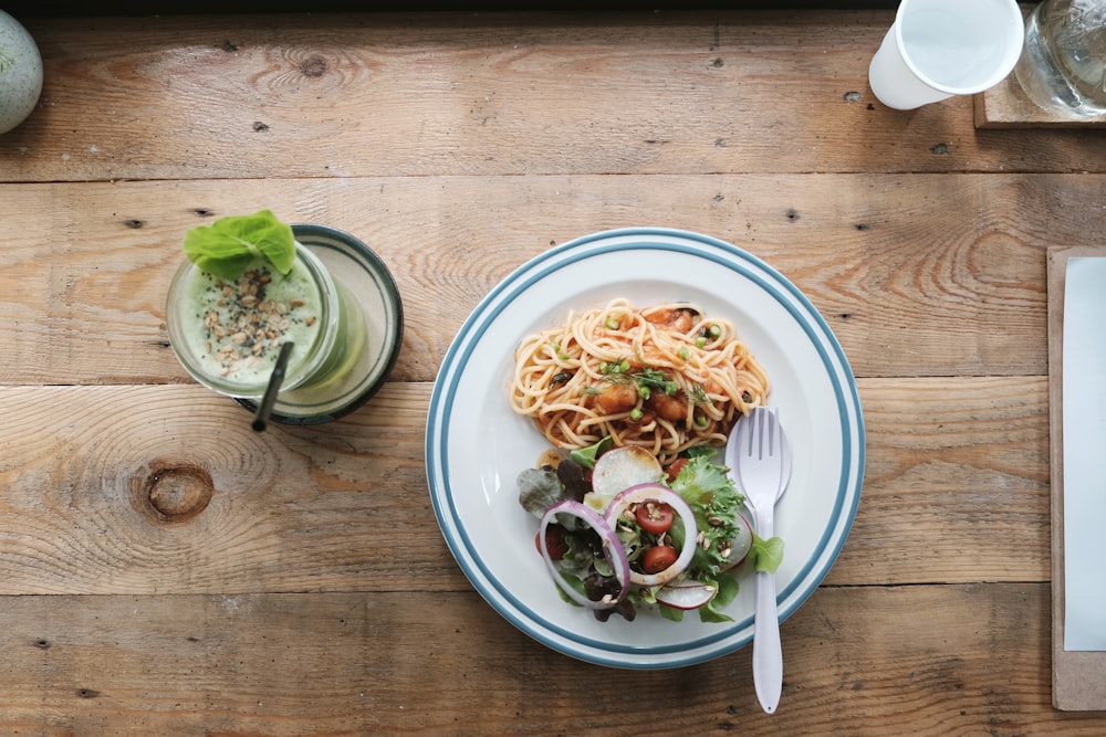 white ceramic plate filled with pasta