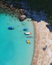 aerial view photography of boats on seashore