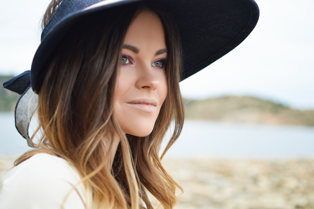 woman wearing black sun hat