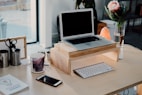 silver MacBook on desk
