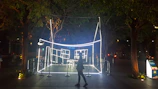 Creative guerrilla marketing installation in an urban setting at night