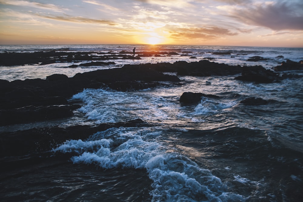 wave of water on rocks