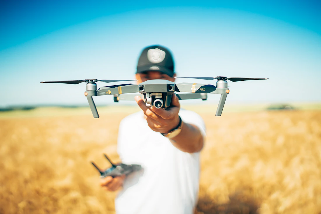 Drone pilot preparing aircraft for takeoff