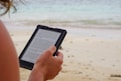 person holding black tablet computer during daytime
