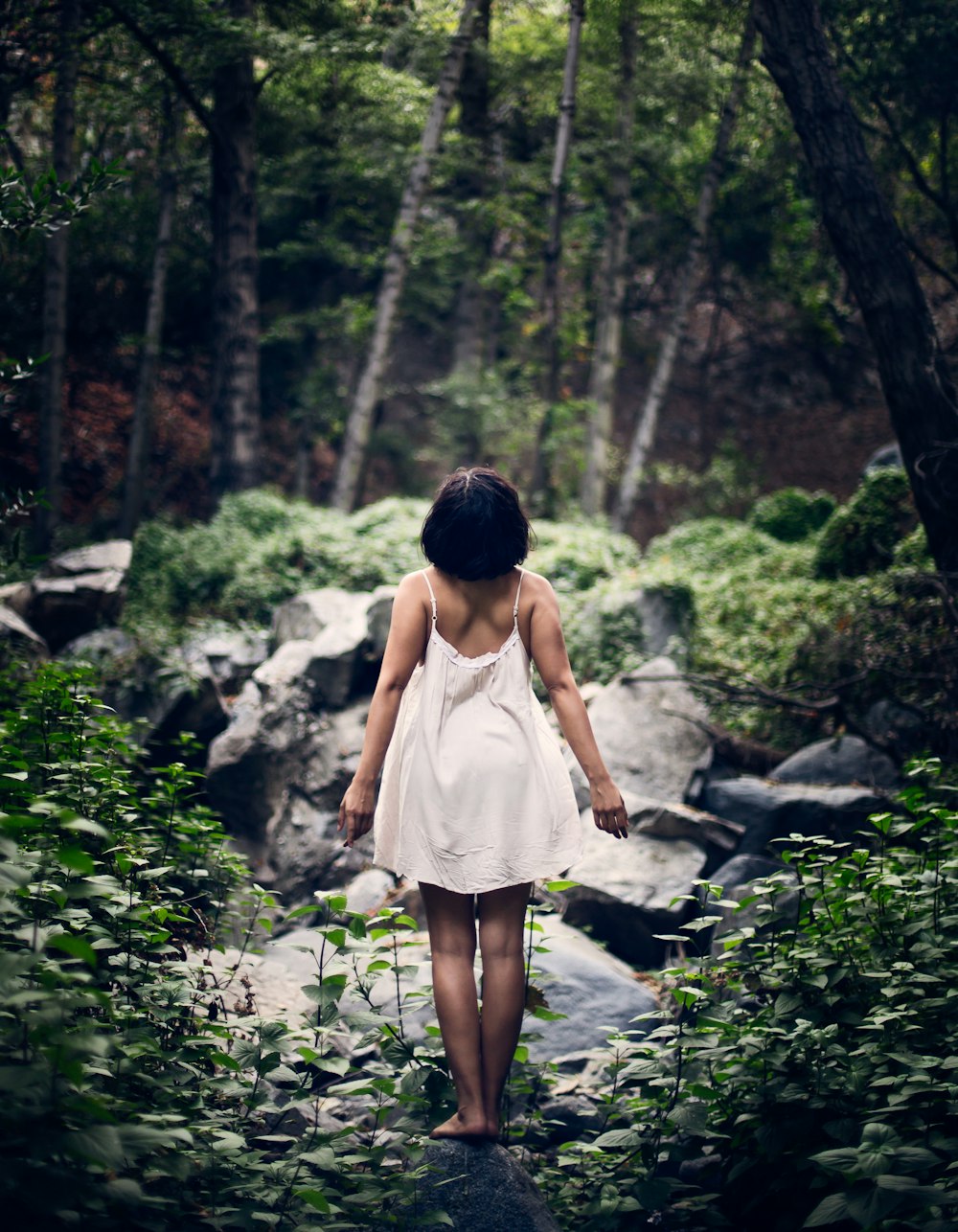 woman standing on stone