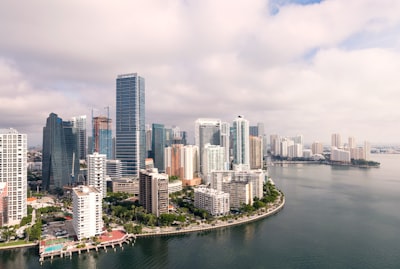 aerial photography of high-rise buildings near sea miami teams background