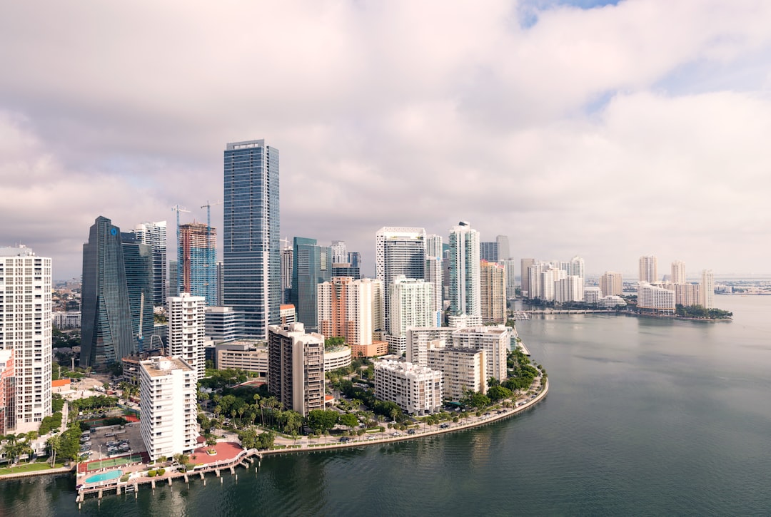 aerial photography of high-rise buildings near sea, Aerial view of downtown Miami and Brickell from a morning flight on 