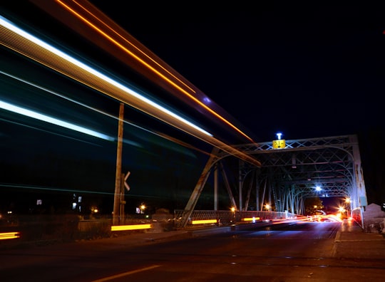 time lapse photography of vehicles crossing suspension bridge in Lachine Canal Canada