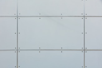 Close-up image of a thermal insulated sandwich panel showing its layers and texture.