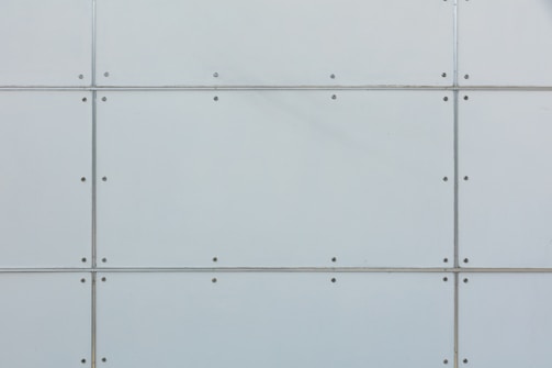 Close-up of a sheet metal structure showing robust welding and insulation layers.