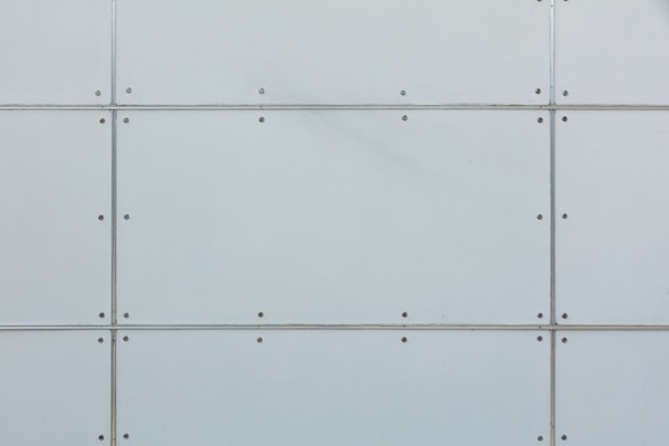 Close-up of steel cementitious system panels being fitted with precision in a data center