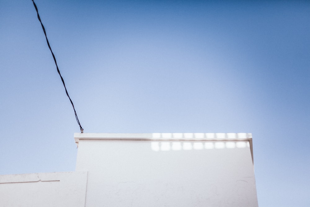 white string lights on white wall