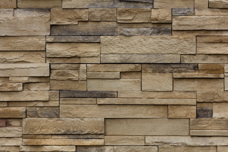 A warm-toned stacked stone feature wall.