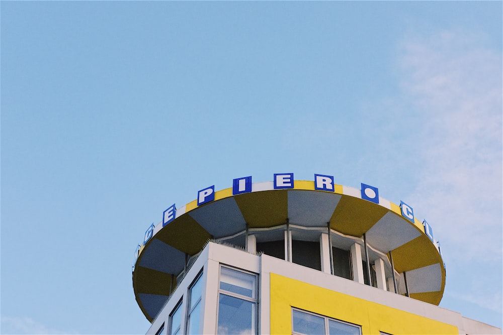 a tall building with a sign on top of it