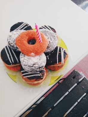 Guests enjoying freshly made mini donuts at a birthday party.
