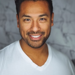 man wearing white V-neck shirt