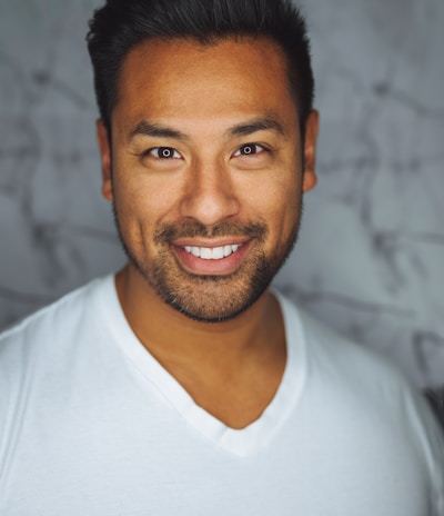 man wearing white V-neck shirt