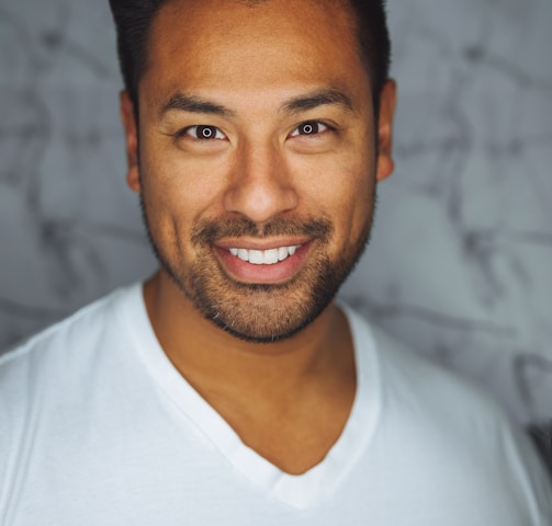 man wearing white V-neck shirt