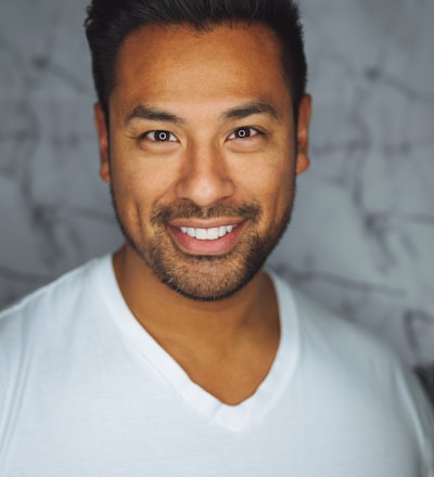 man wearing white V-neck shirt