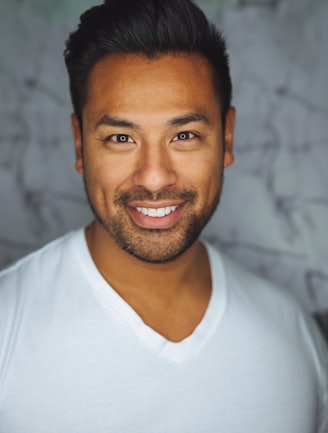 man wearing white V-neck shirt