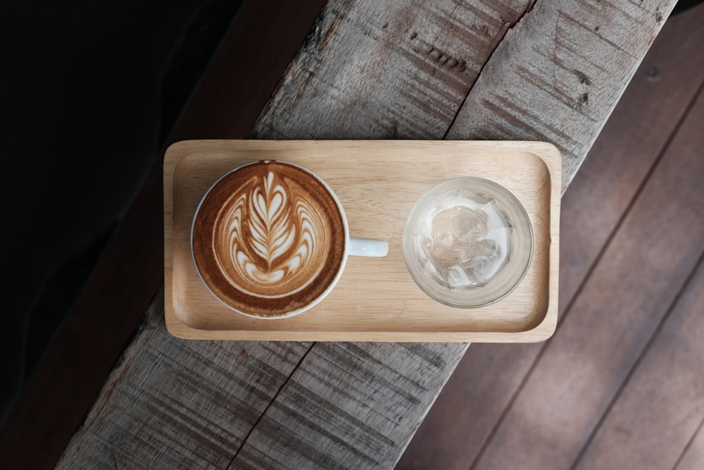 photo of coffee latte on tray