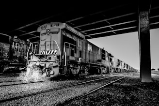 grayscale photography of train on station