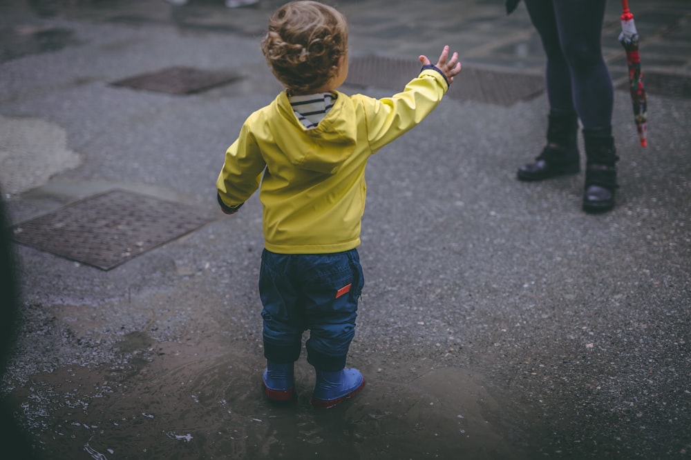 boy wearing yellow hoodie