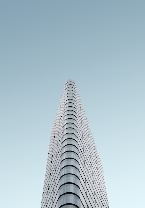 grey glass high-rise building during daytime