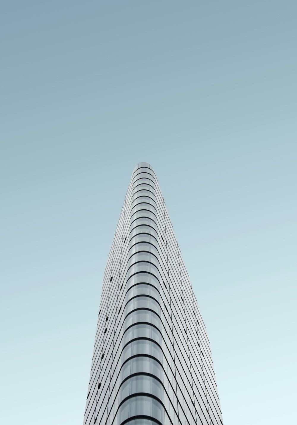 grey glass high-rise building during daytime
