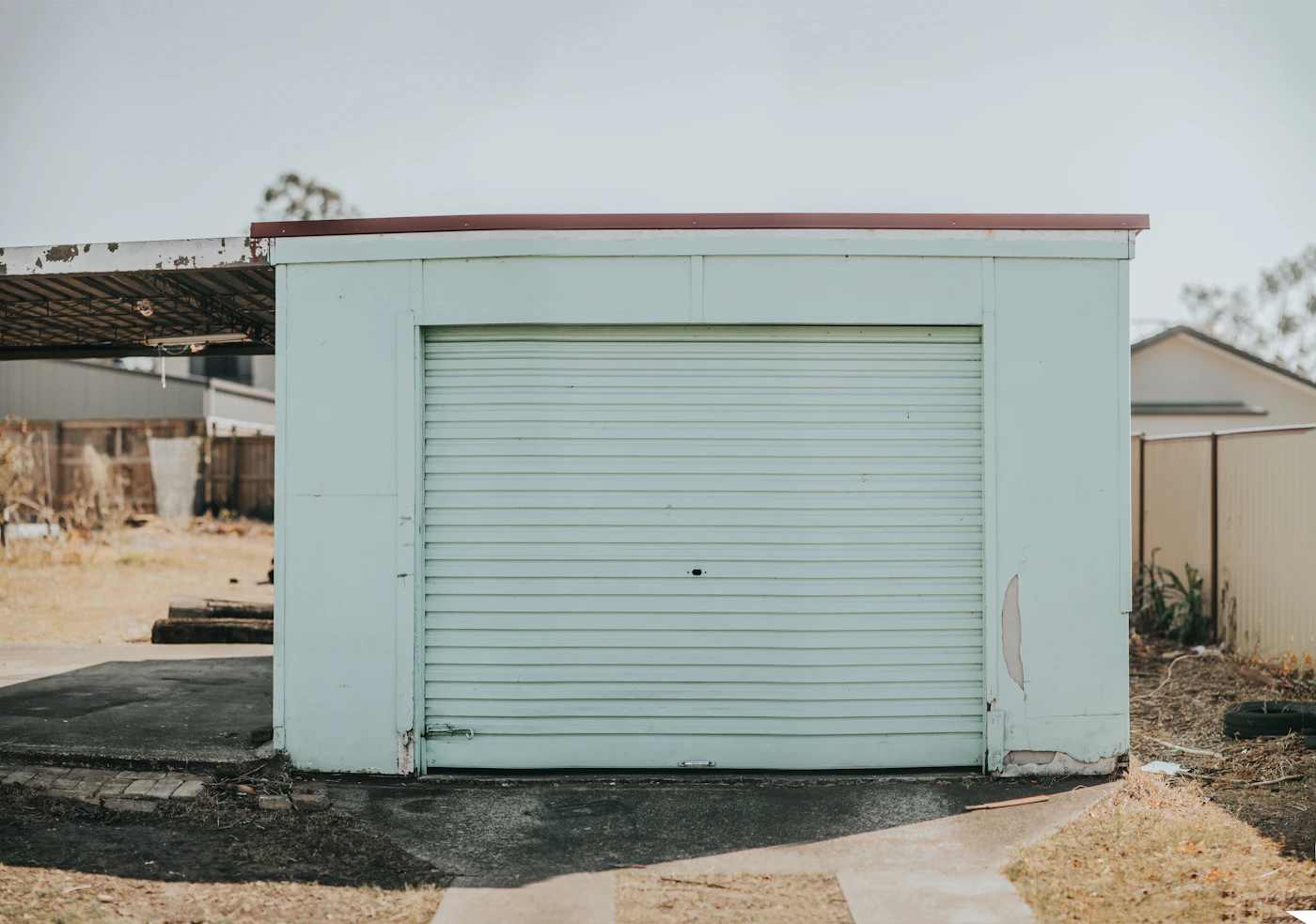 Close-up of a garage door's panels and track, where most repairs actually happen