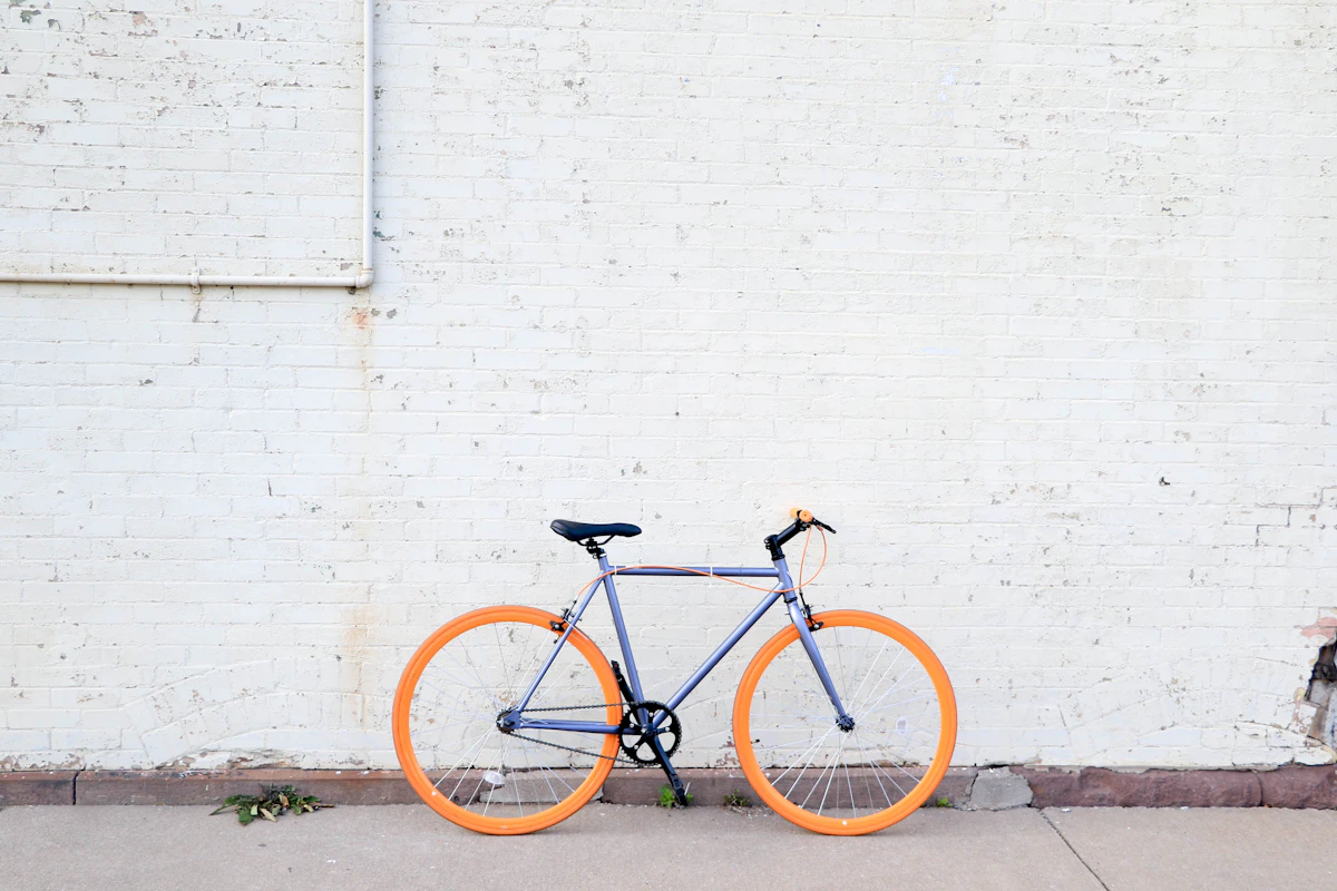 Cyclist riding a bicycle on a city route with premium commuter cycling gear