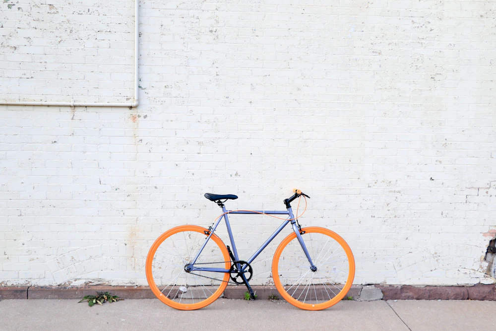 Urban bicycle parked beside city architecture
