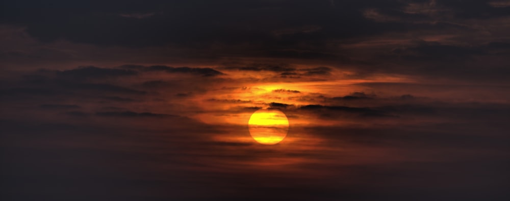 sunset covered by cloudy skies