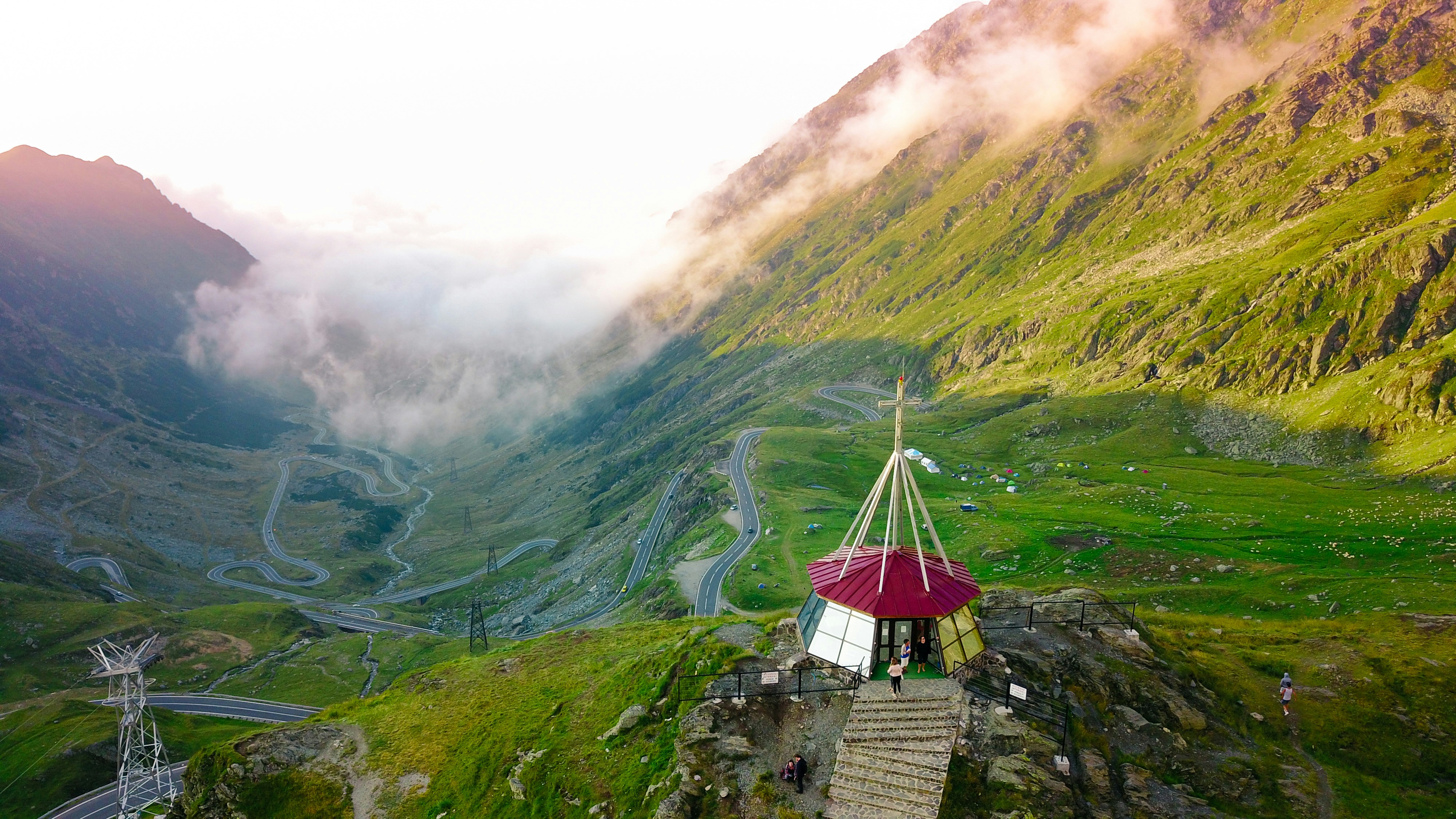 red and yellow tent surrounded grass field