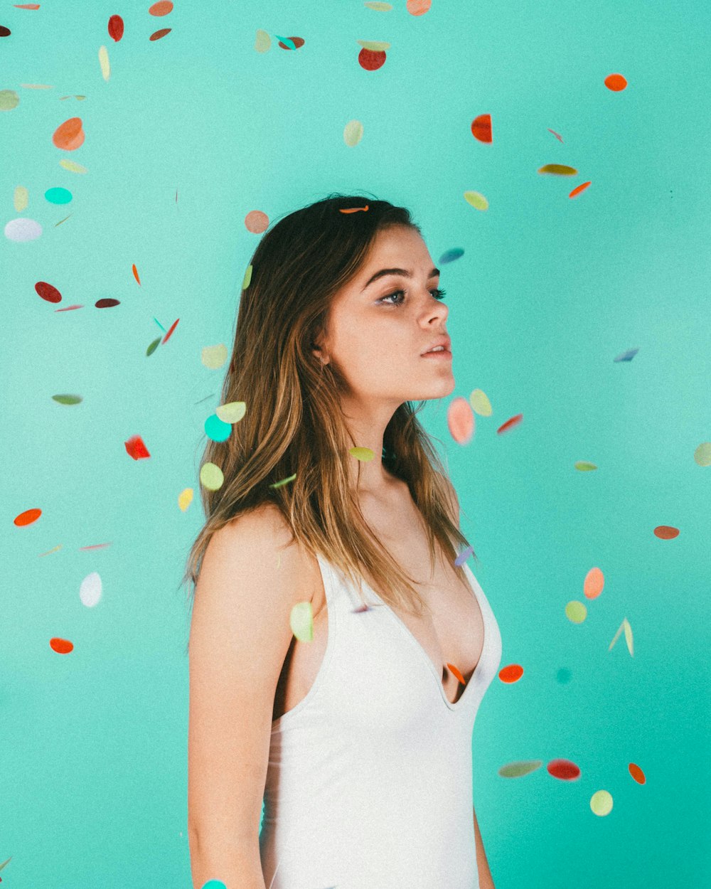 woman standing surrounded with confetti