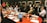 A diverse group of professionals engaged in a collaborative meeting around a conference table.
