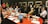 A diverse group of professionals engaged in a collaborative meeting around a conference table.