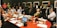 A diverse group of professionals engaged in discussions at a conference.