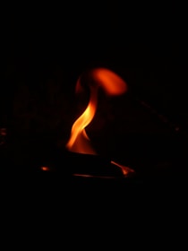 A vibrant flame symbolizing new beginnings and hope.